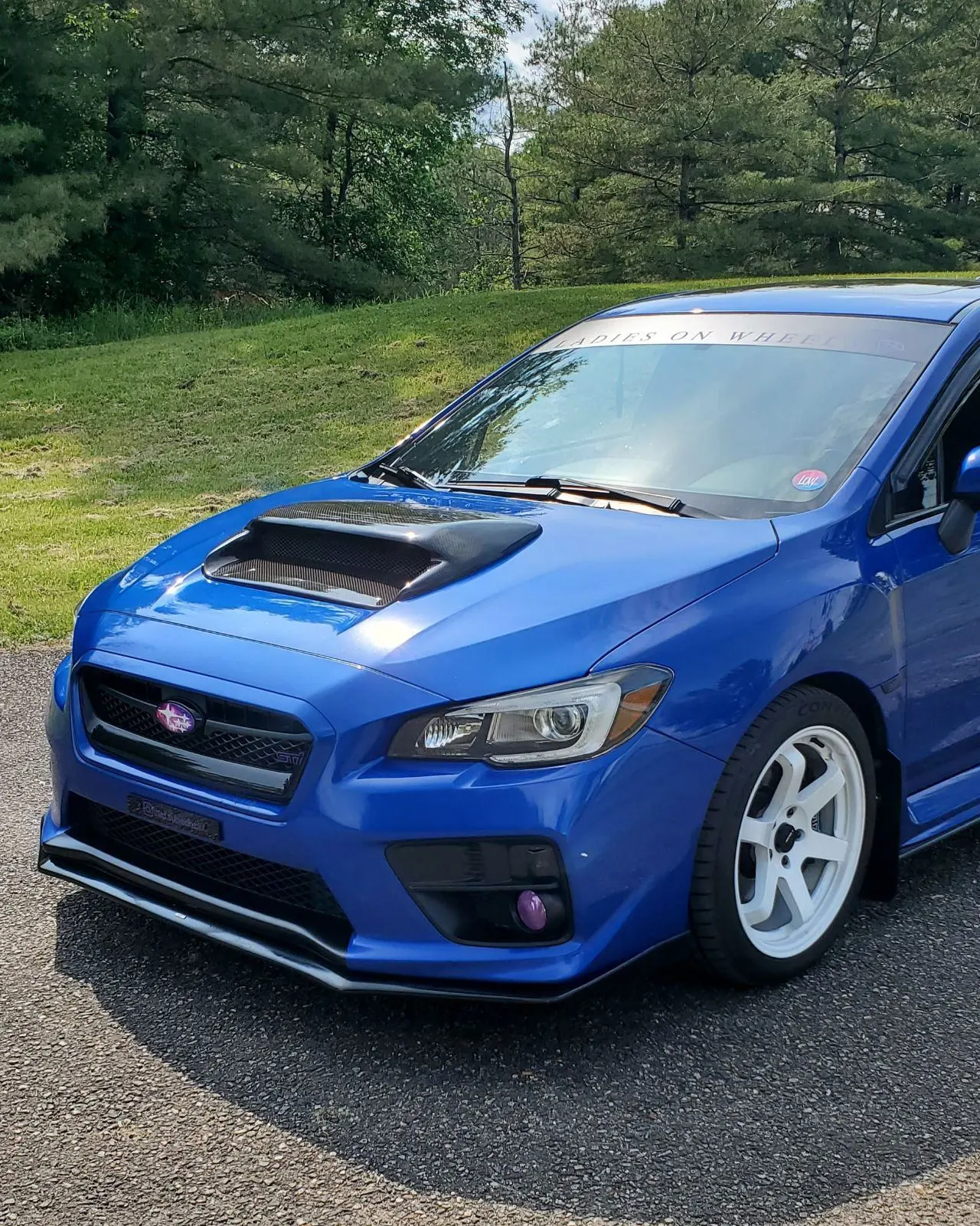Front view of the 2016 STI with a carbon fiber hood scoop
