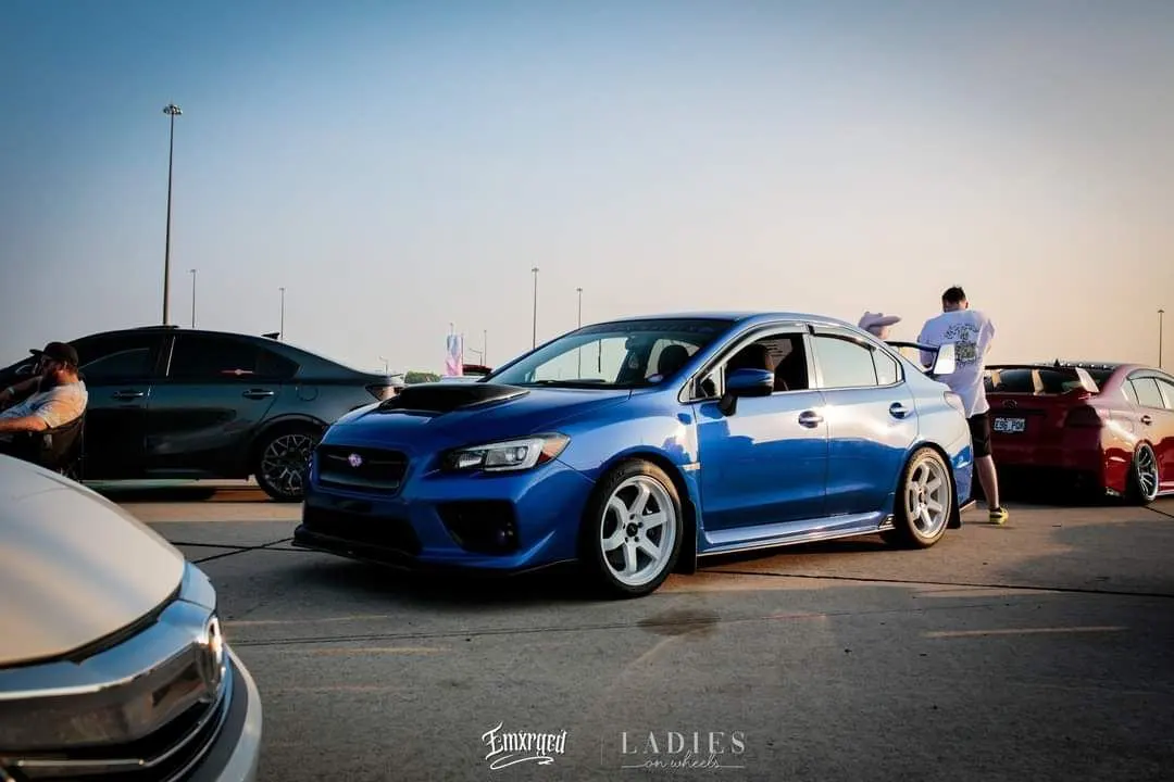 2016 STI seen from a distance surrounded by other cars